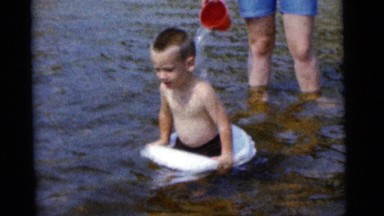 1963: swimming in water with the family members