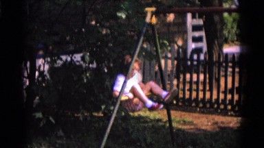 1963: a little lad is showing acrobatics on the pole in the garden CAMDEN