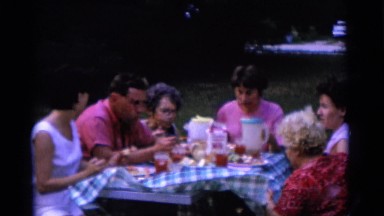 1963: family is enjoying food outdoor in a sunny day and wishing CAMDEN