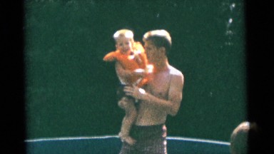 1963: a father with child is seen near a christmas tree CAMDEN, NEW JERSEY