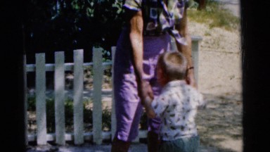 1963: a father is seen playing with children CAMDEN, NEW JERSEY