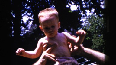 1961: lovable father with cute son on his shoulder in the sunlight DETROIT