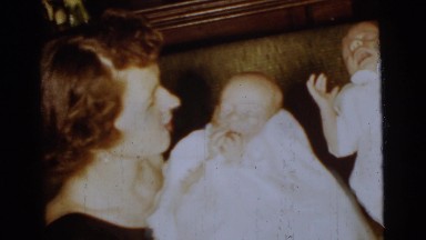 1961: a mother with a small child is seen DETROIT, MICHIGAN