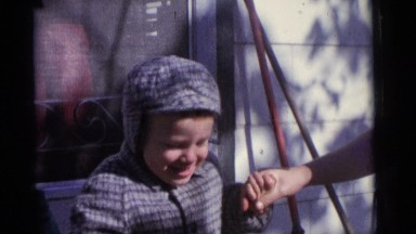 1963: proud baby boy taking hand of mother winter walking CAMDEN, NEW JERSEY