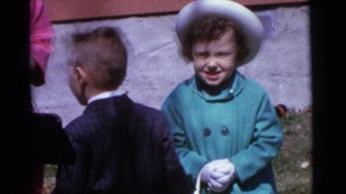 1963: kid wanders around as family struggles to take family portrait CAMDEN