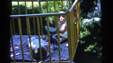 1961: babies playing outside in their crib DETROIT, MICHIGAN