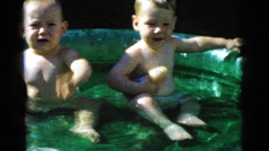 1961: two babies sitting and enjoying in a bathtub. DETROIT, MICHIGAN