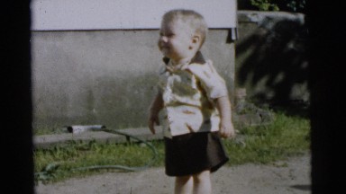 1961: a toddler trying to walk and maintain his balance DETROIT, MICHIGAN