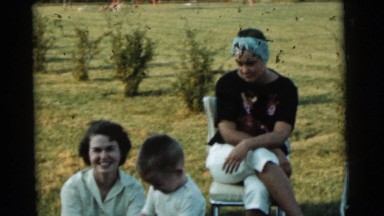 1961: Summer Fun Laughing in the Sunshine While Lounging in Folding Chairs