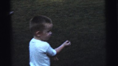 1961: children play in the backyard on a nice day DETROIT, MICHIGAN