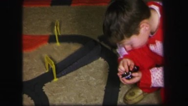 1974: Kids Having a Wonderful Time on the Floor with Their Race Toys in Lynbrook