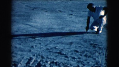 1961: A Man Writing in the Sand at Clarksdale, Arizona Beach