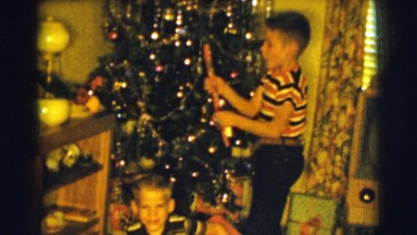 1961: boys are unwrapping christmas presents CLARKSDALE, ARIZONA