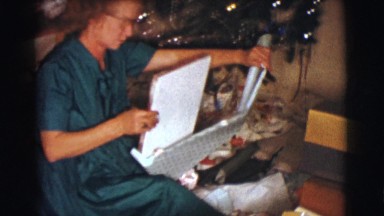 1961: a christmas tree is seen with a child opening presents CLARKSDALE, ARIZONA