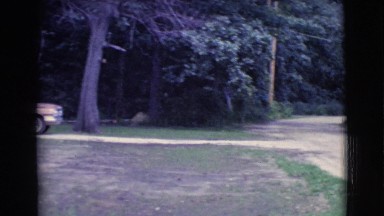 1961: a car parked in the driveway in front of a nice, simple single story house