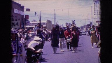 1961: a big crowd turns out for the town procession. CLARKSDALE, ARIZONA
