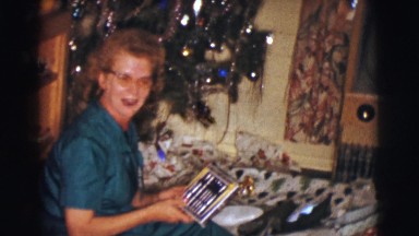 1961: opening presents under the christmas tree CLARKSDALE, ARIZONA