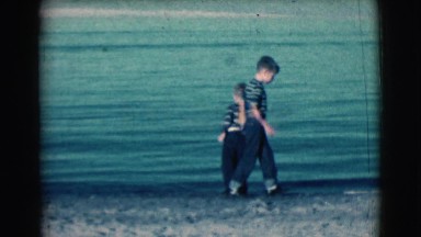 1961: boys with father by the sea CLARKSDALE, ARIZONA
