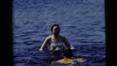 1962: woman swimming with a group of people CAMDEN, NEW JERSEY