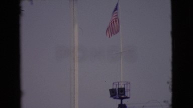 1968: tower near water with united states flag blowing in the wind COTTONWOOD