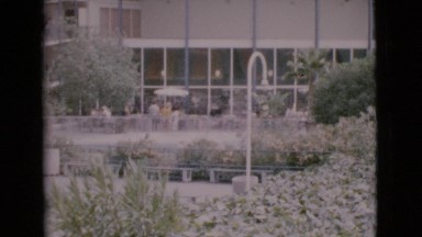 1968: people are standing in the plaza in front of an office building