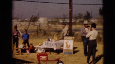 1968: children playing at a yard sale alongside a busy highway CLARKSDALE