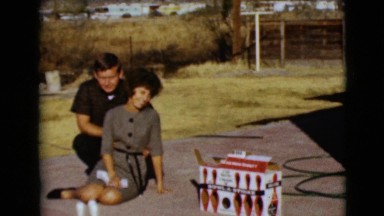 1968: a young family outside in the driveway with bowling pins CLARKSDALE