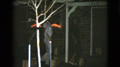1968: an older couple opening a door and walking into a house