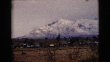 1968: large mountain range covered with snow under overcast sky CLARKSDALE