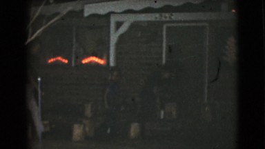 1968: dark vintage video of friends and family in front of house