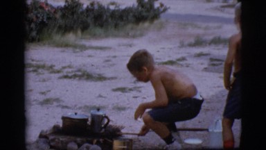 1968: a topless kid is seen pouring in a pot COTTONWOOD, ARIZONA