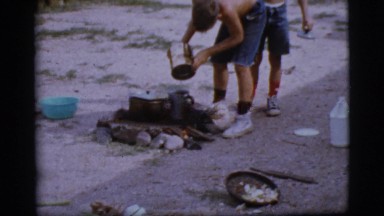 1968: a topless kid is seen pouring in a pot COTTONWOOD, ARIZONA