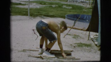 1968: a topless kid is seen pouring in a pot COTTONWOOD, ARIZONA