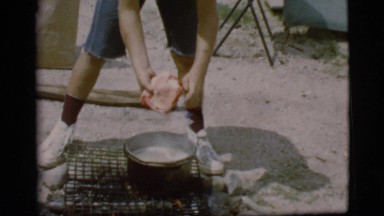1968: a topless kid is seen pouring in a pot COTTONWOOD, ARIZONA