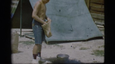 1968: a topless kid is seen pouring in a pot COTTONWOOD, ARIZONA
