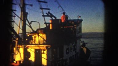 1962: sailing away in the tugboat under the beautiful sunset and clear skies