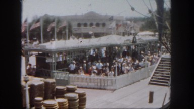 1962: a crowd is seen posing beside a car. SAN PEDRO, CALIFORNIA