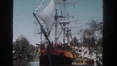 1962: hundreds of people on the dock are boarding a ship. SAN PEDRO, CALIFORNIA