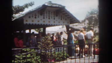 1962: various people at an amusement park climbing into a ride SAN PEDRO