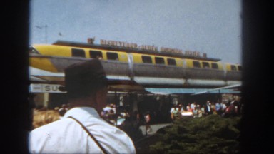 1962: a crowd is seen posing beside a car. SAN PEDRO, CALIFORNIA