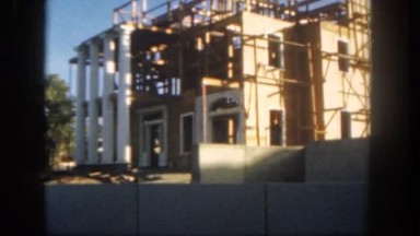 1962: Building Site, Classical-Looking College or Public Building, with Man