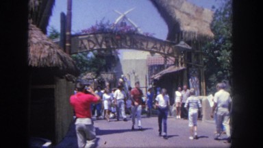 1962: dozens of people entering and exiting an amusement park DISNEYLAND