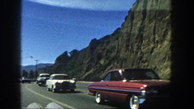 1962: cars are seen passing by a building DISNEYLAND, CALIFORNIA