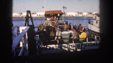 1962: a boat is seen brought into water being pushed down by people DISNEYLAND