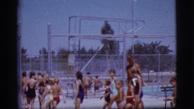 1968: a crowd files into a local swimming pool COTTONWOOD, ARIZONA