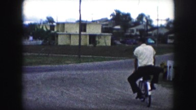 1958: a man is seen riding a cycle AMES, IOWA