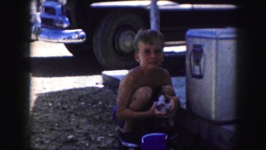 1958: a topless kid is seen washing AMES, IOWA