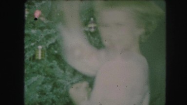1958: two children helping to decorate a christmas tree