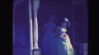 1958: fun old time wedding in church with bridesmaids and groom looks happy