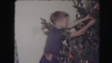 1958: a child near a christmas tree AMES, IOWA